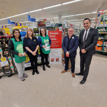 Gagan with Tesco Superstore employees